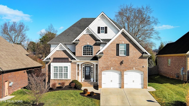 view of front property with a garage and a front lawn