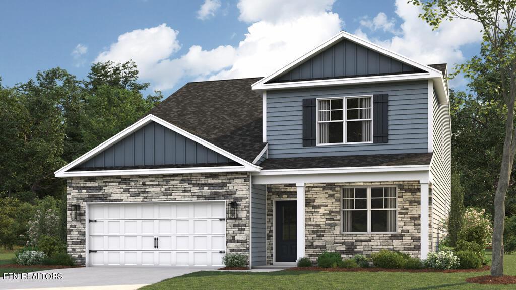 craftsman house featuring a garage and a front yard