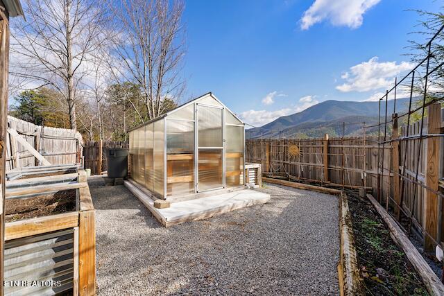 view of outdoor structure featuring a mountain view