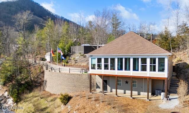 rear view of house with a mountain view