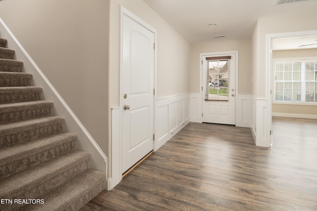 entryway with dark wood-type flooring