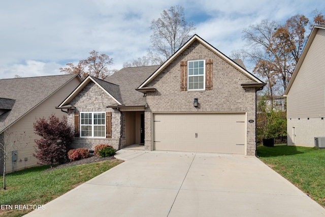 view of front of house featuring a garage, central AC, and a front lawn