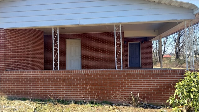 view of property exterior with brick siding