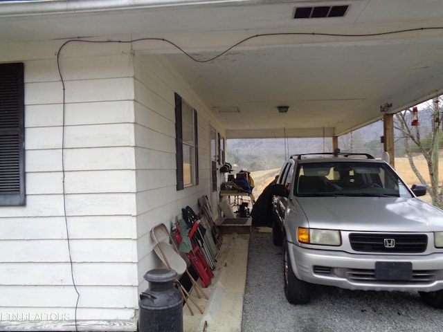 garage featuring a carport