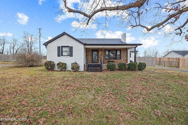 ranch-style home featuring a porch and a front lawn