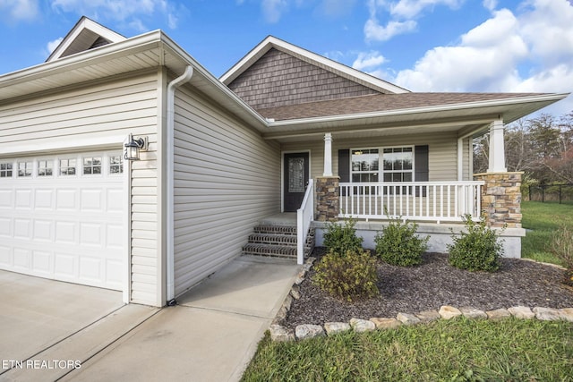 view of front of house with a garage and a porch