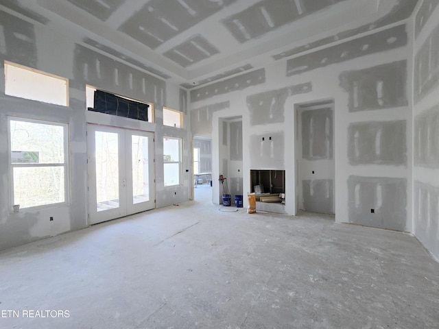 unfurnished living room with french doors