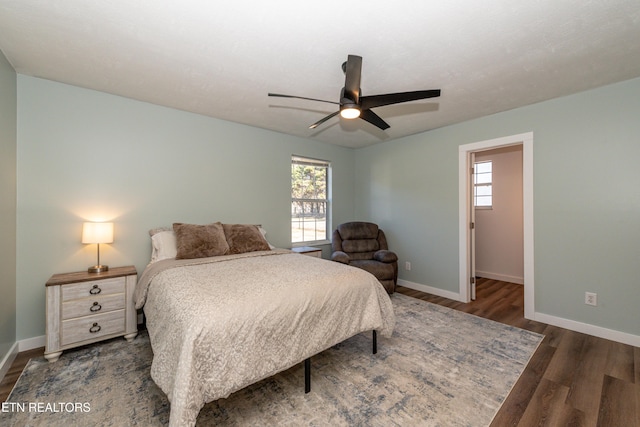 bedroom featuring ceiling fan and dark hardwood / wood-style flooring