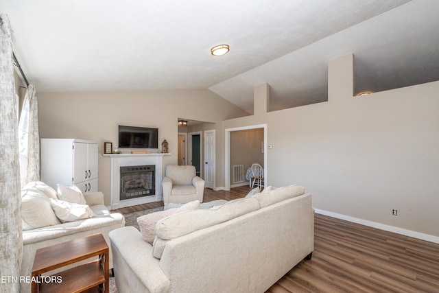 living room with wood-type flooring and vaulted ceiling