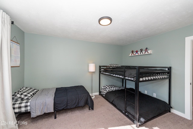 bedroom with light colored carpet