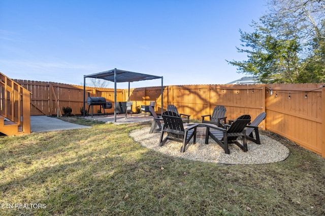 view of yard featuring a patio and an outdoor fire pit