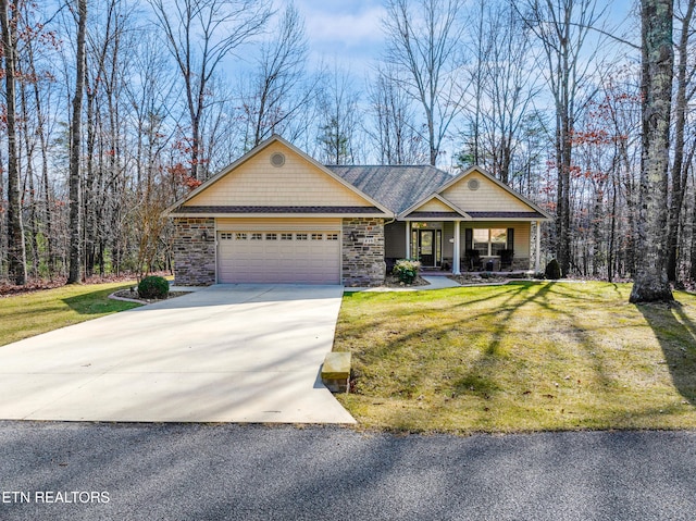 view of front of house with a garage and a front yard