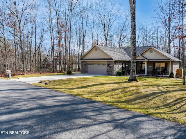 view of front of property with a garage and a front yard