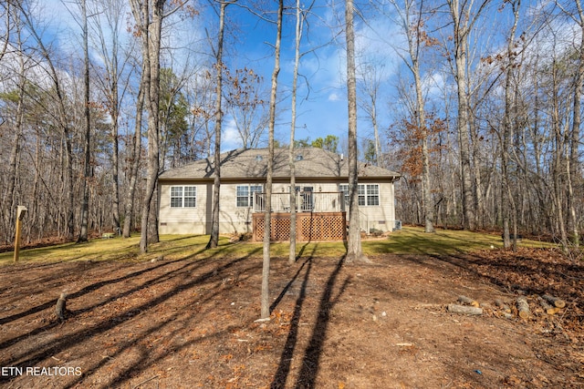 single story home featuring a deck