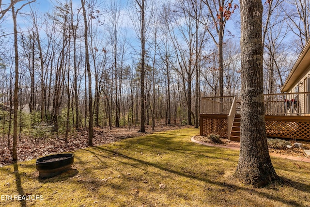 view of yard featuring a wooden deck