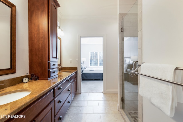 bathroom featuring crown molding, vanity, tile patterned flooring, and walk in shower