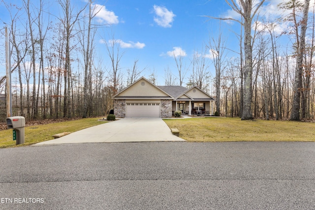 view of front of house featuring a garage and a front yard