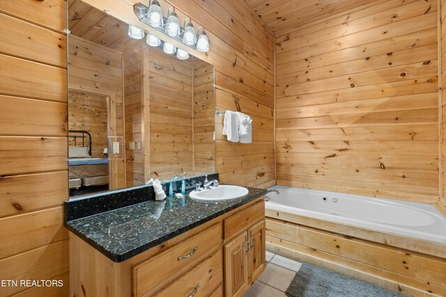 950 Black Bear Cub Way, Sevierville, TN 37862 - bathroom with vanity, a bath, tile patterned floors, and wooden walls