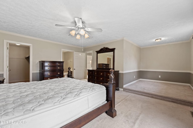 bedroom with crown molding, ceiling fan, light carpet, and a textured ceiling