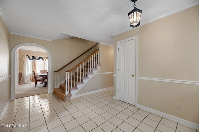 tiled foyer with crown molding