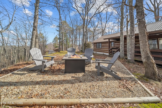 view of yard featuring an outdoor fire pit