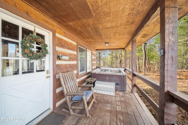 wooden deck featuring a fire pit