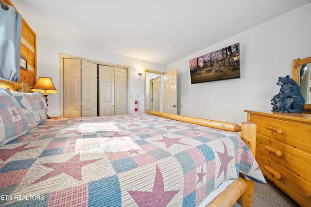 carpeted bedroom with a closet