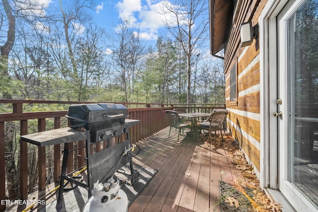 deck featuring a grill