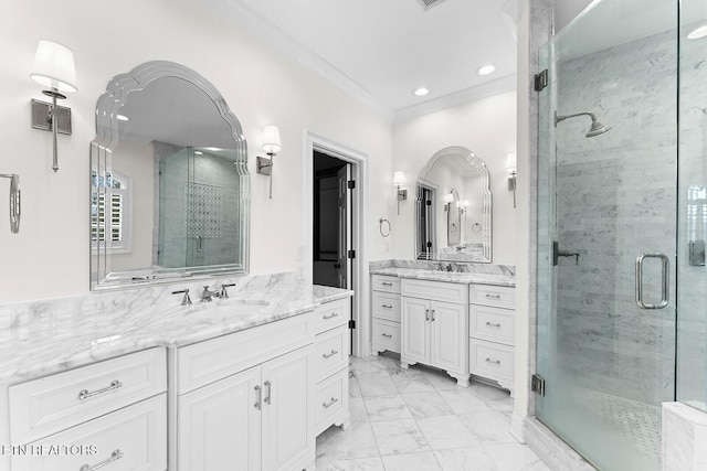 bathroom with crown molding, vanity, and an enclosed shower