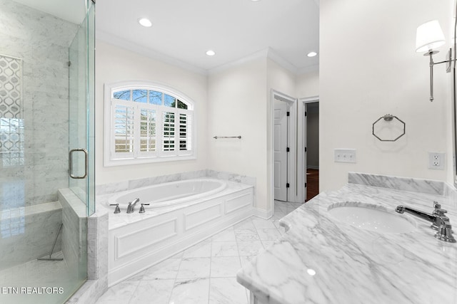 bathroom featuring vanity, crown molding, and shower with separate bathtub