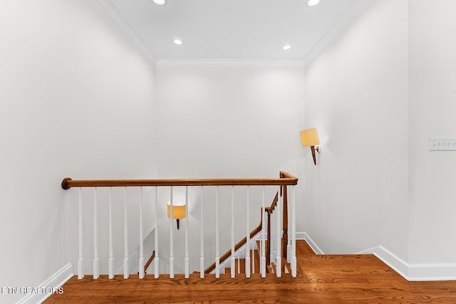 staircase featuring crown molding