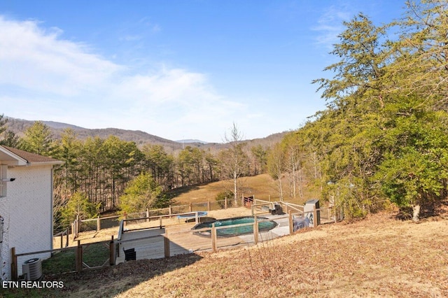 view of yard featuring cooling unit and a mountain view