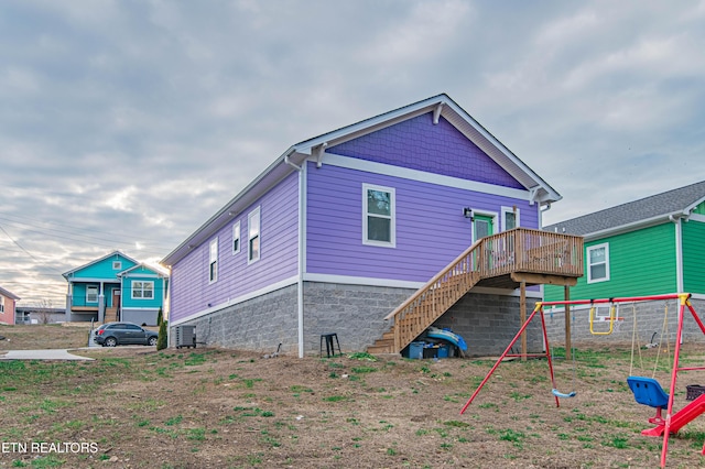 back of house with a deck