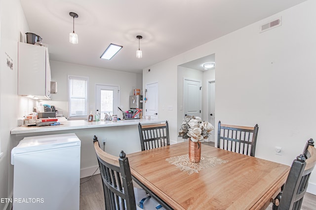 dining space featuring light hardwood / wood-style flooring