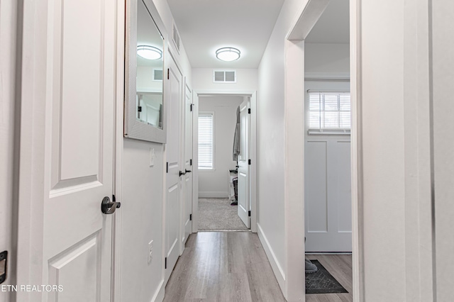 corridor featuring light wood-type flooring