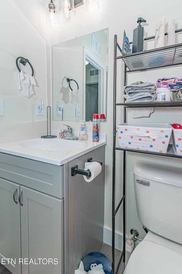 bathroom with vanity and toilet