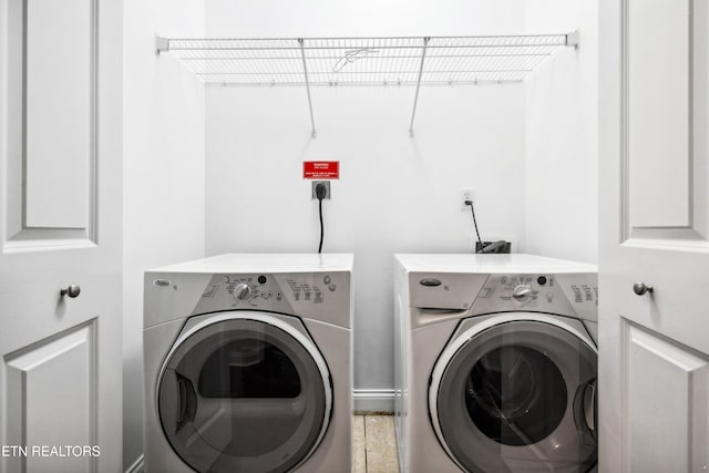 laundry room with independent washer and dryer