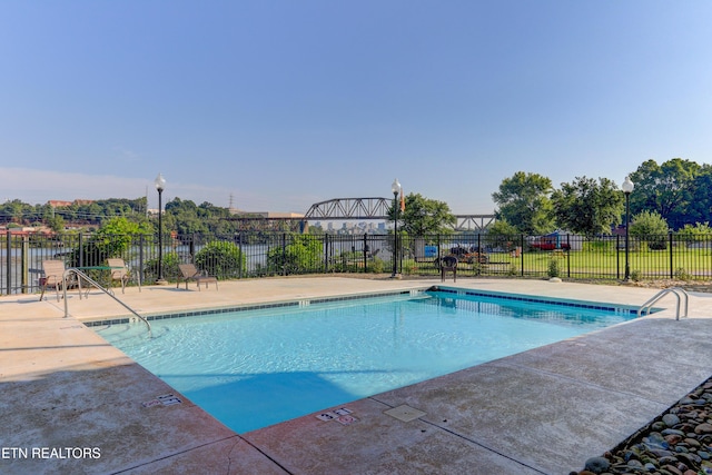 view of pool featuring a patio area