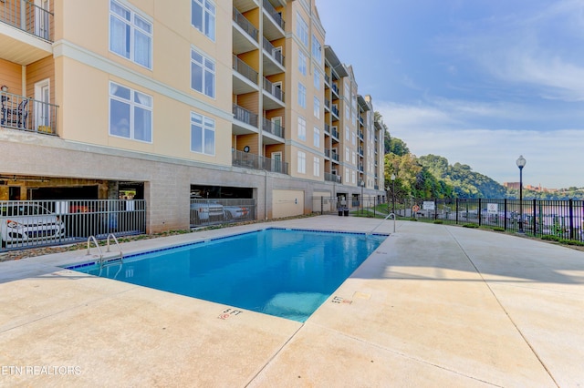 view of swimming pool with a patio area