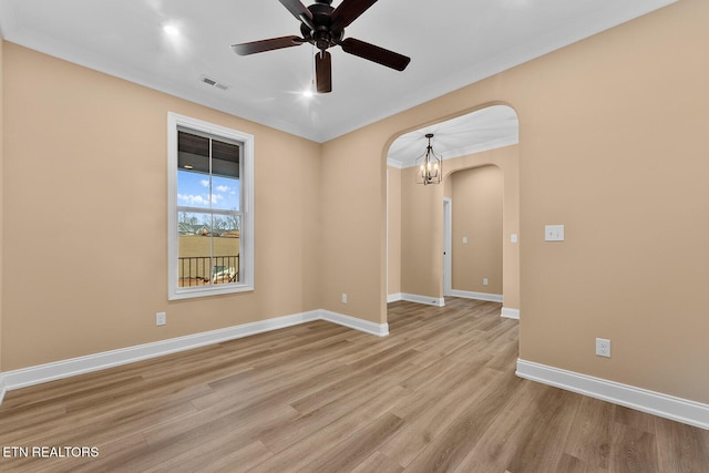 unfurnished room with ceiling fan, crown molding, and light hardwood / wood-style floors