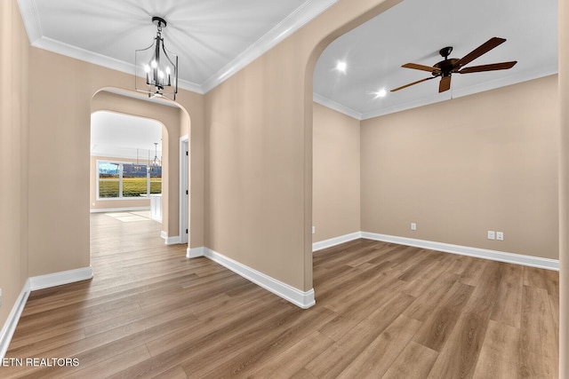 corridor featuring ornamental molding, wood-type flooring, and a chandelier