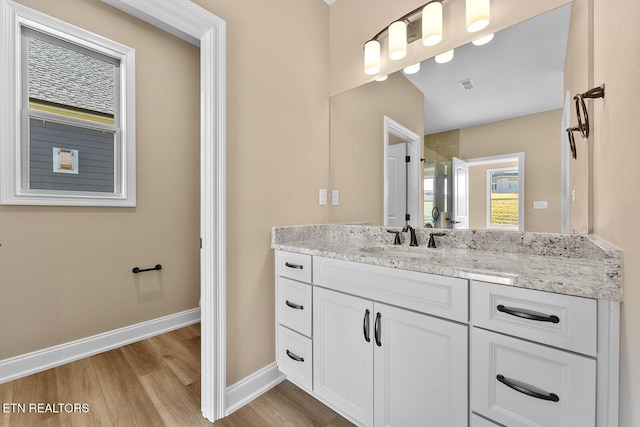 bathroom featuring vanity and hardwood / wood-style floors