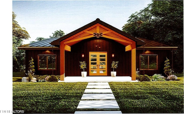 property entrance with french doors, a porch, board and batten siding, a standing seam roof, and metal roof