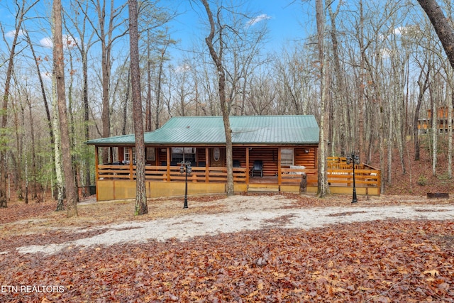 log cabin featuring a porch