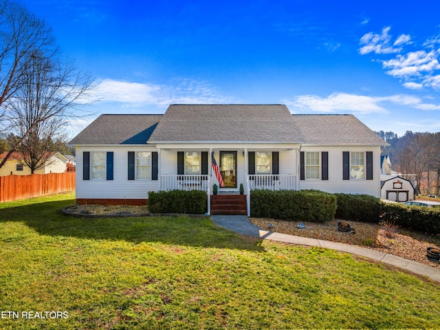 ranch-style house with covered porch and a front yard