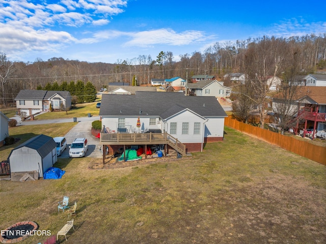 rear view of property featuring a deck