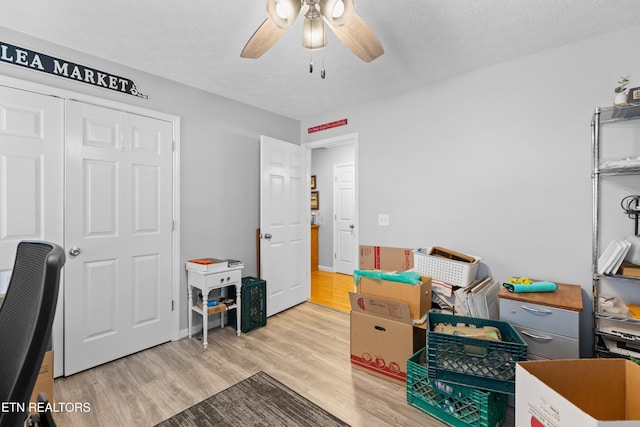 interior space with ceiling fan