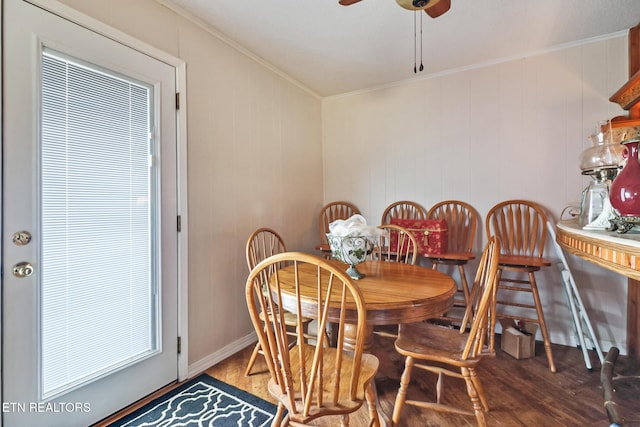 dining area featuring crown molding, ceiling fan, and wood-type flooring