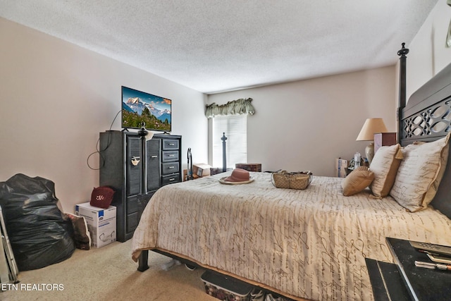 carpeted bedroom with a textured ceiling