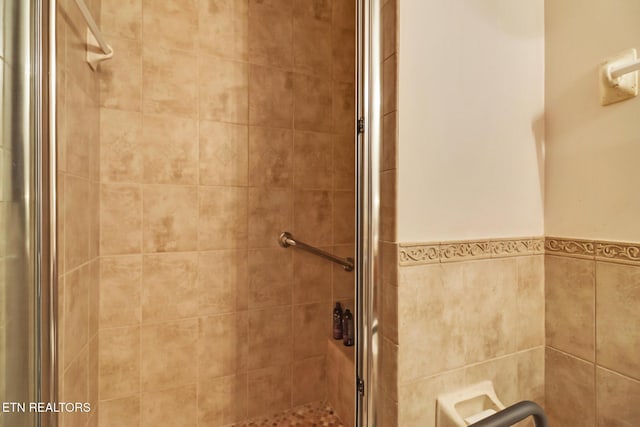 bathroom featuring an enclosed shower